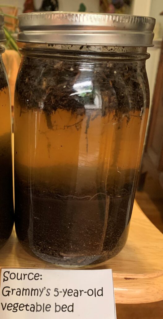 This jar shows the results of the soil experiment on the sample of soil from Grammy's five-year-old vegetable bed.