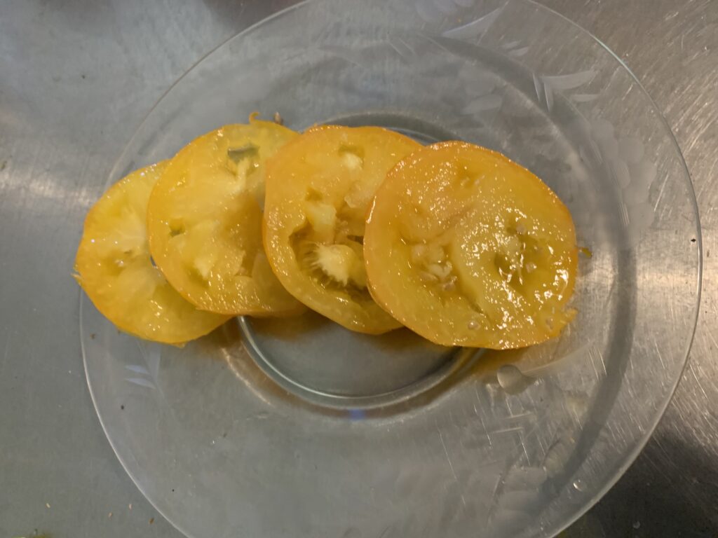 This photo shows sliced Lemon Boy tomatoes on a plate.  My favorite tomato variety is Lemon Boy.  These tomatoes  are tasty as well as a beautiful yellow color.