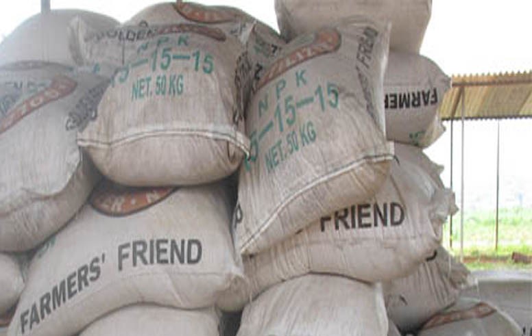  Photo shows a stack of bags of fertilizer labeled N P K 15-15-15.  
Photo courtesy of ttps://live.staticflickr.com/8465/8144240712_a360789692_z.jpg