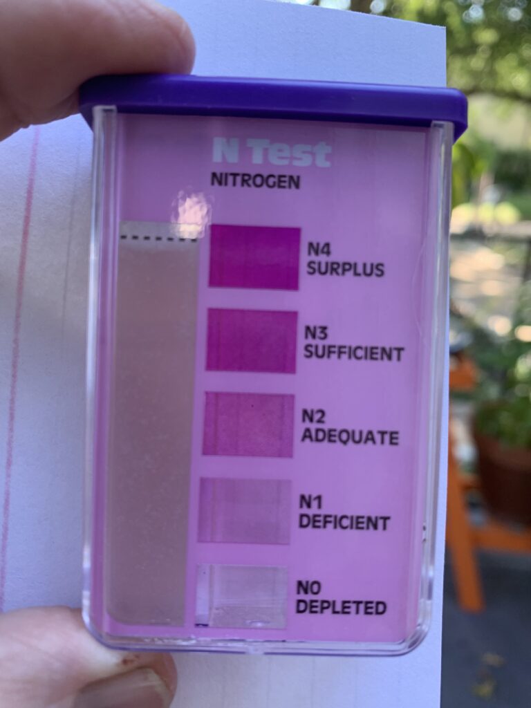 This photo show the nitrogen test which by the color of the solution shows shows a deficient amount of nitrogen in the soil.  Time to add compost and other sources rich in  nitrogen.