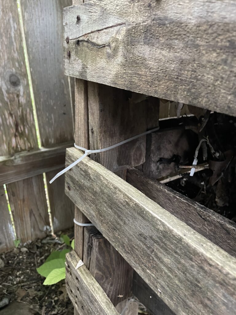 This photo shows the cables ties around the back of the pallets holding them together.